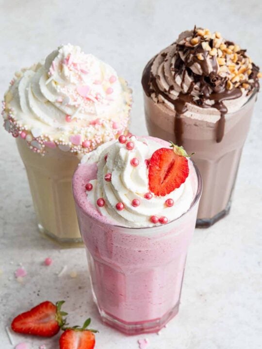 Premium Photo  Chocolate vanilla strawberry milk shake milkshake